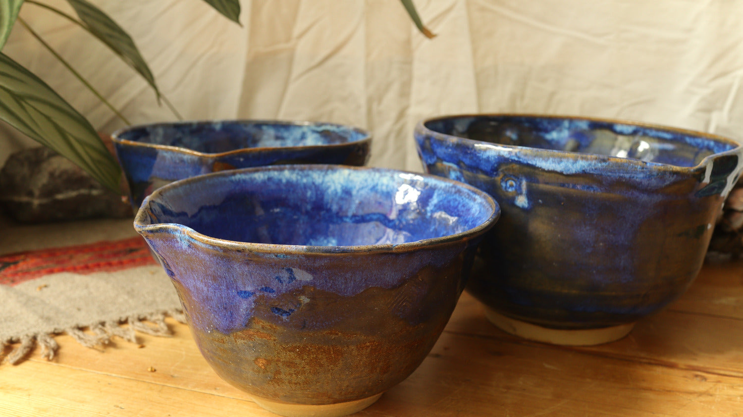 Nesting set of mixing bowls, blue glaze.